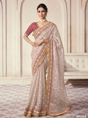 Beige organza saree features art silk blouse
